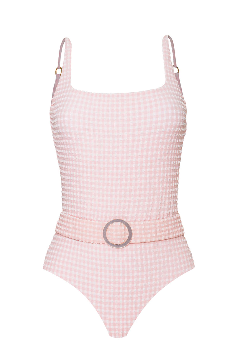 A light pink textured one piece swimsuit against a white wall.