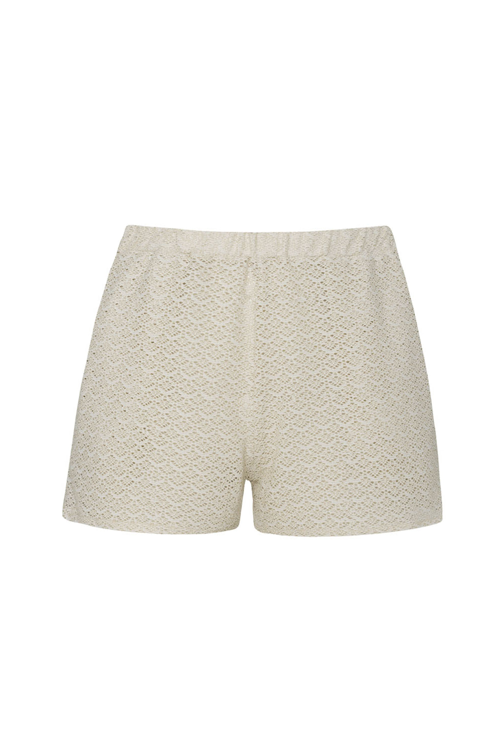Ivory shorts with intricate details against a white wall.