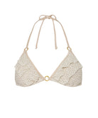 An ivory triangle bikini top against a white wall.