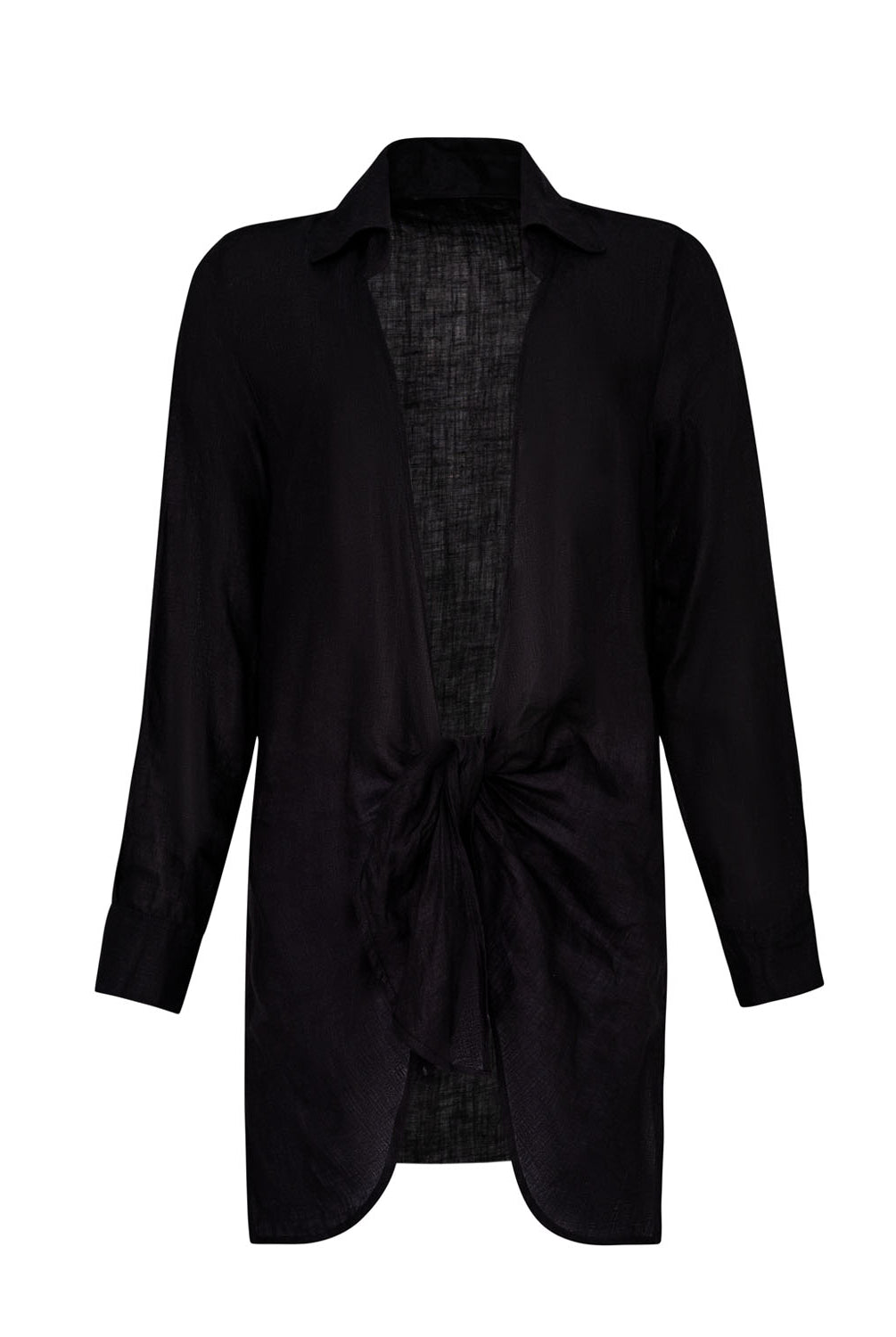 A long sleeve linen cover up against a white wall.