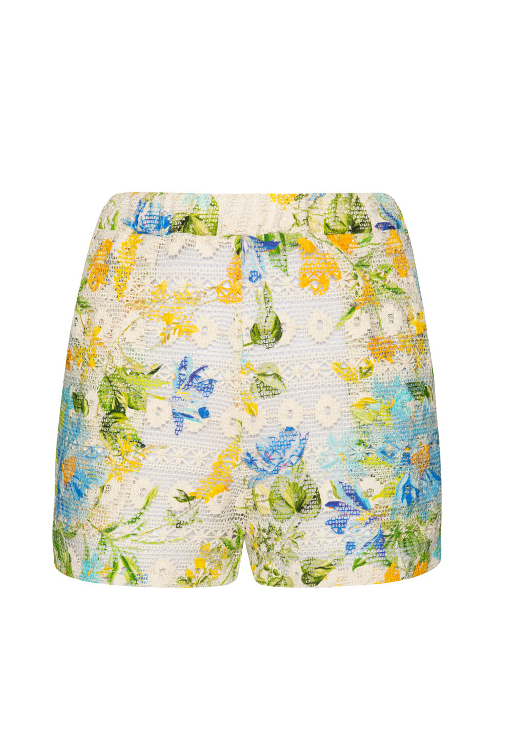 Floral shorts against a white wall.