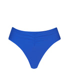 Blue high waist bikini bottoms against a white wall.