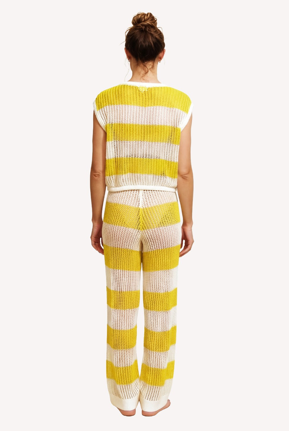 Person wearing a yellow and white striped outfit on a white background