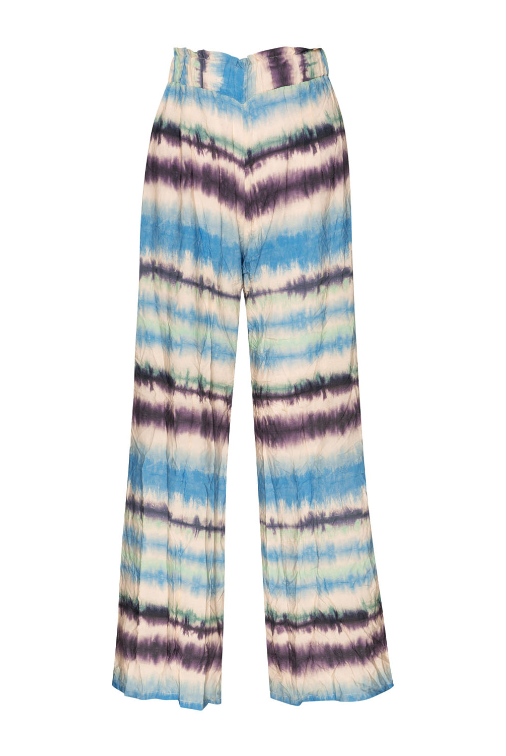 Tie dye long pants against a white wall.