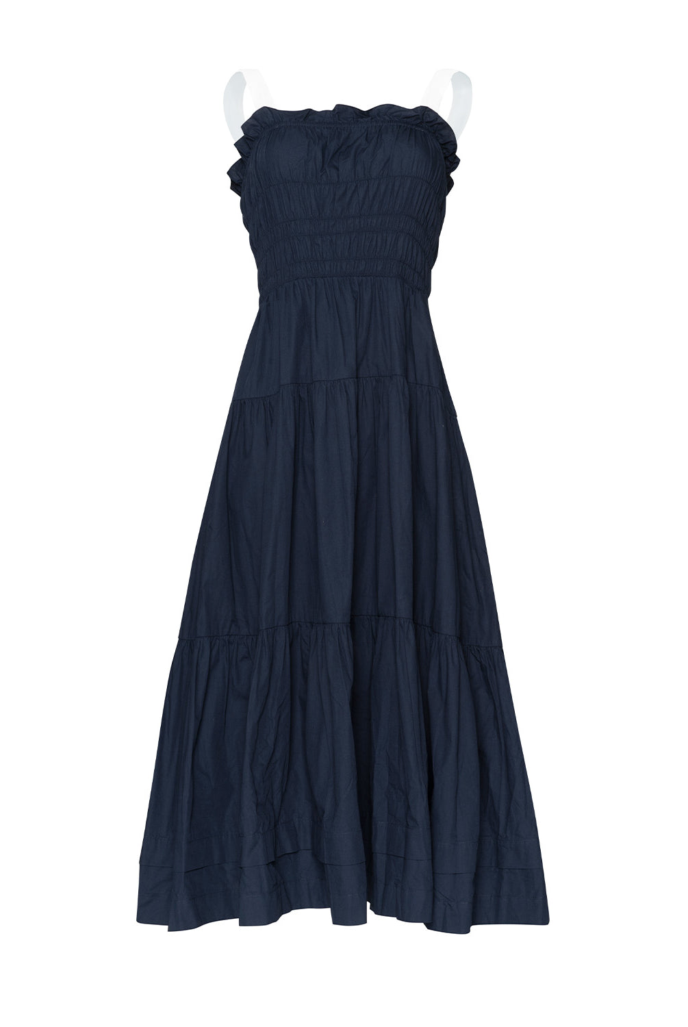 A navy dress with white straps against a white wall.