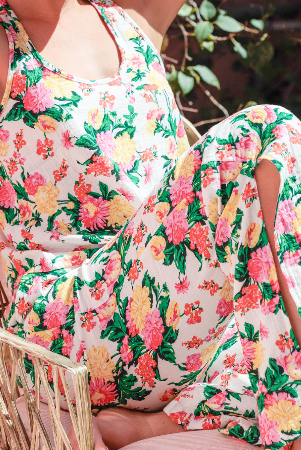 Dahlia Racerback Tank – lightweight tropical floral tank with scoop neckline and airy winged racerback, offering a relaxed, comfortable fit ideal for lounging or vacation mornings, styled with matching wide-leg pants.