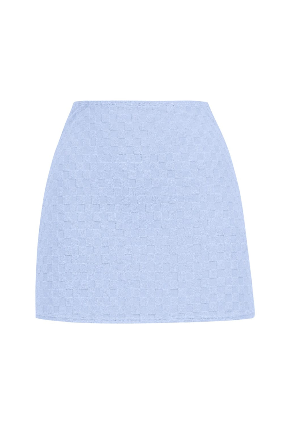 A blue mini skirt against a white wall. 