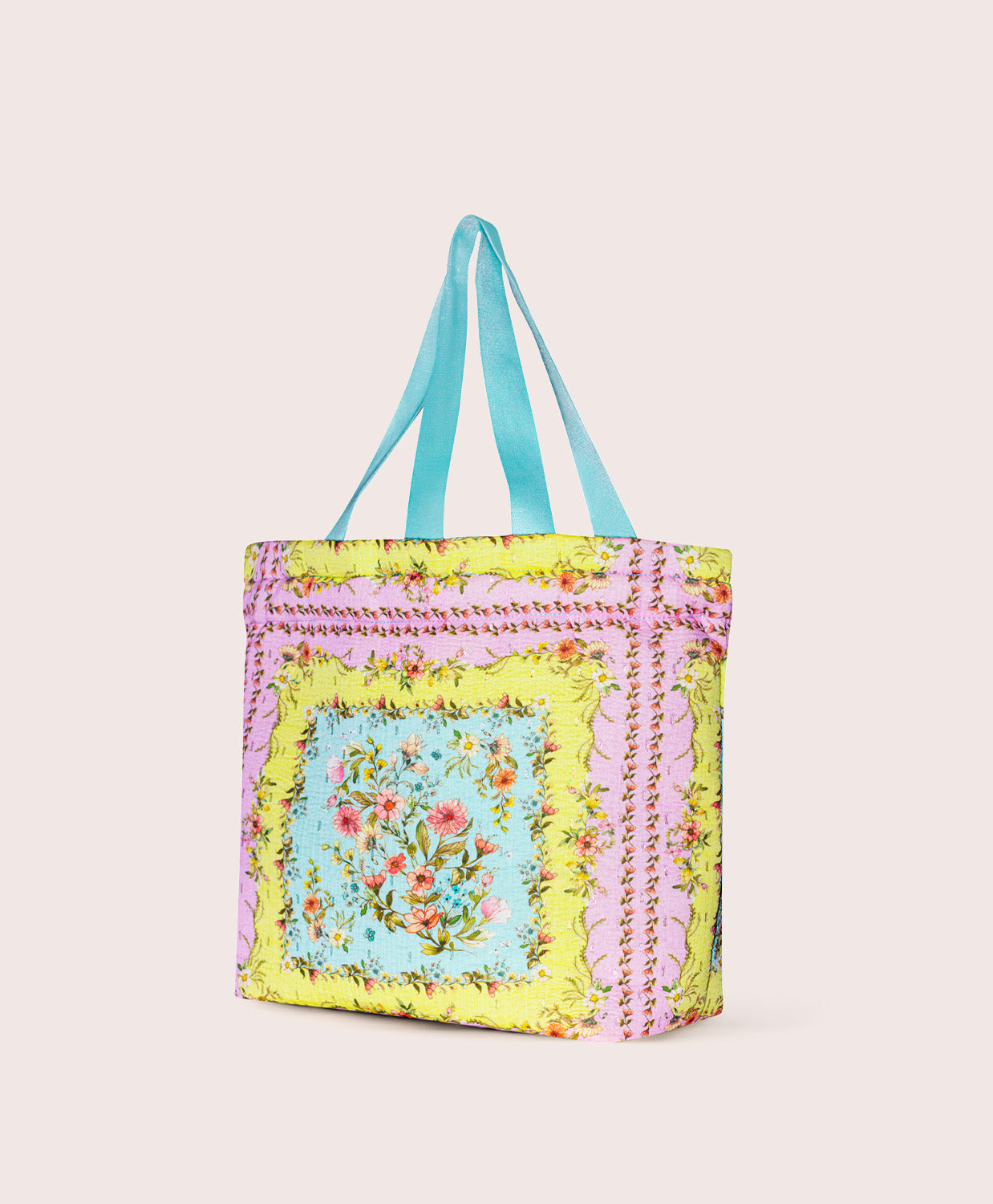 Colorful tote bag with floral design on a plain background