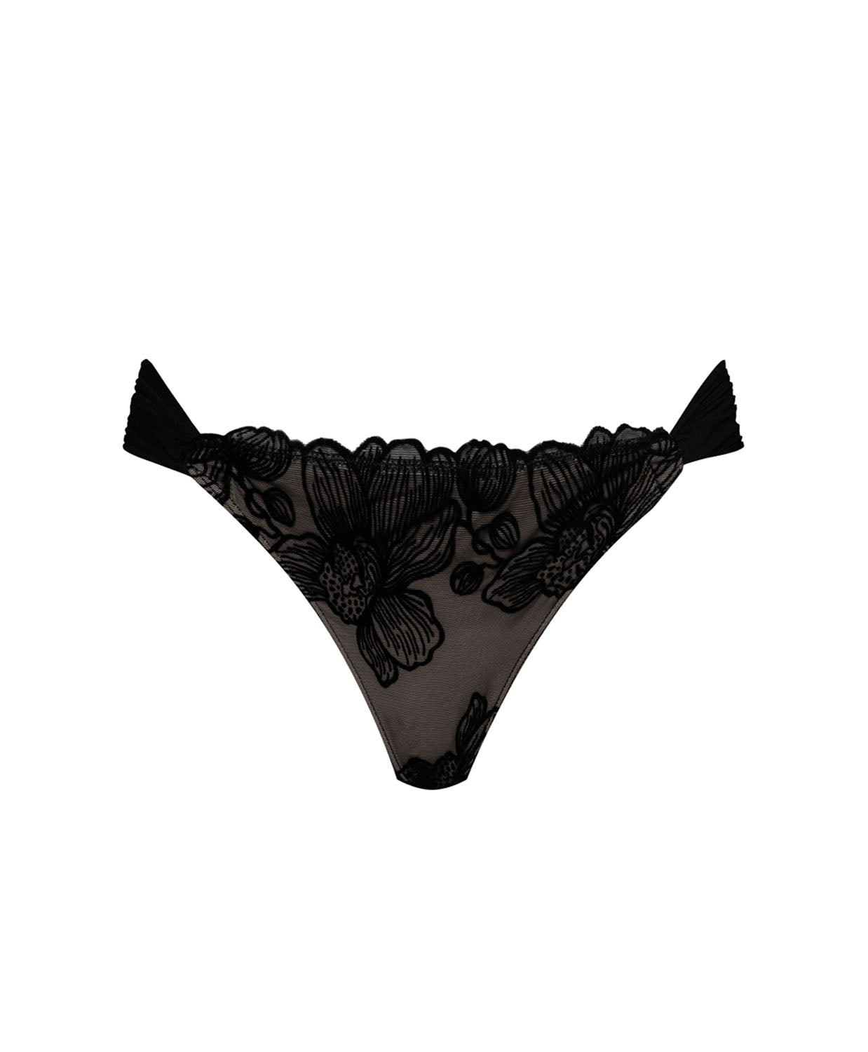 A black bikini bottom with flower details against a white wall.