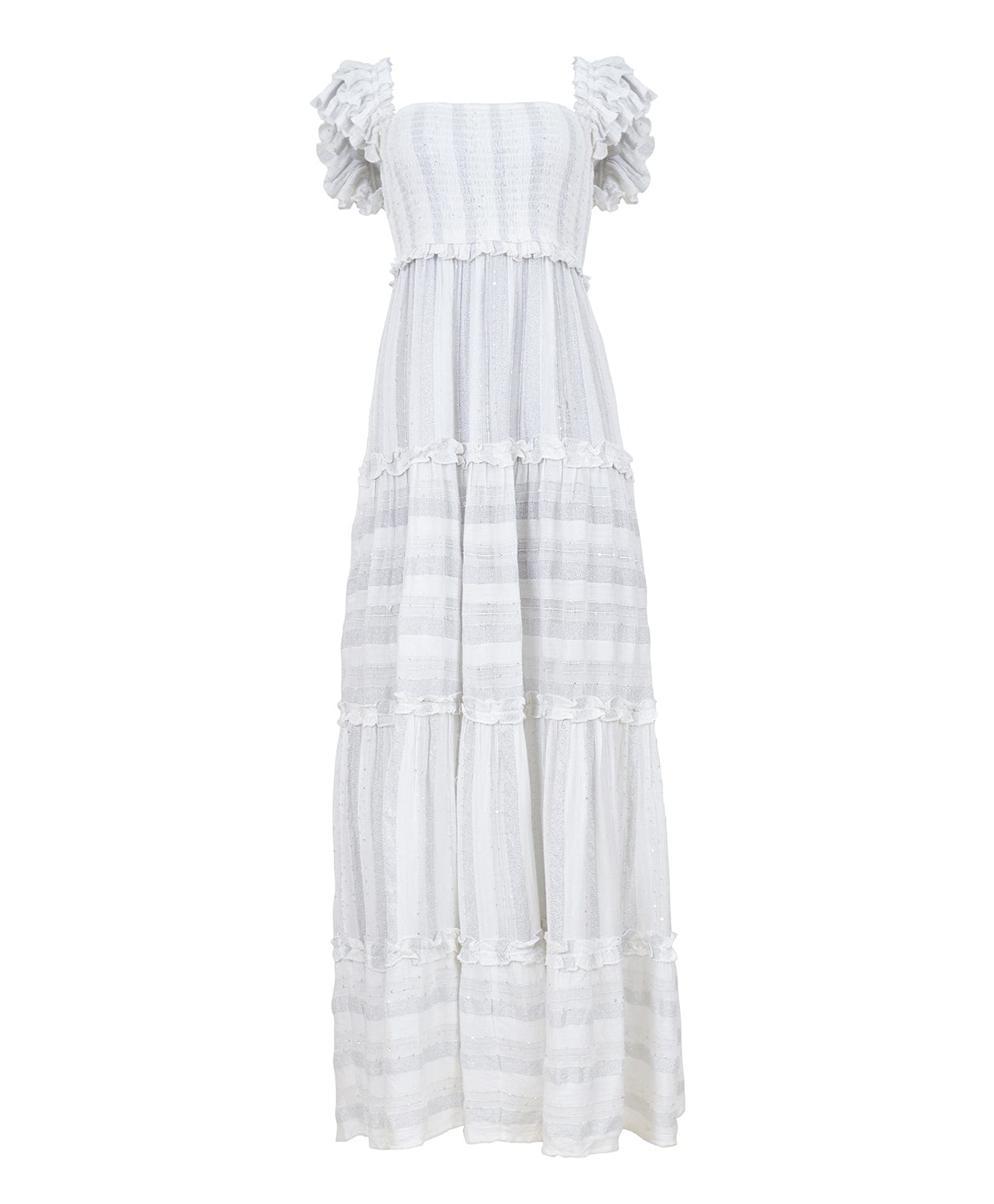 A long white dress against a white wall.