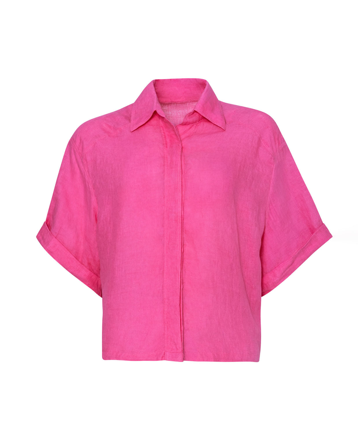 A pink linen shirt against a white wall.