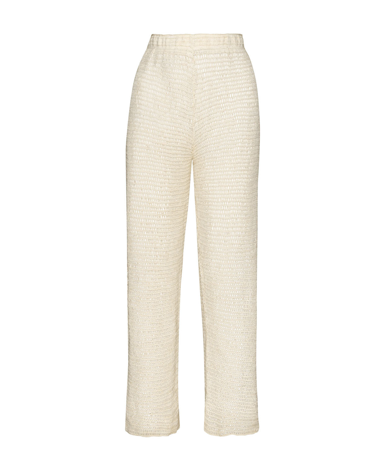 Ivory knit pants against a white wall.