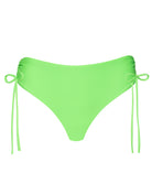 A green bikini bottom against a white wall.