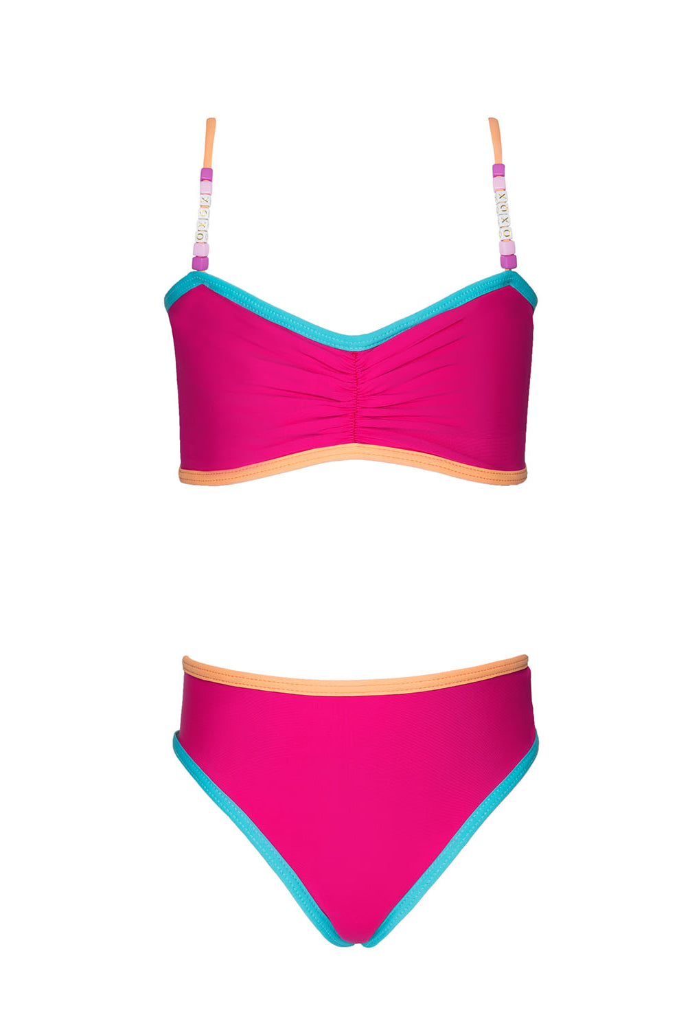 A pink bikini with blue trim against a white wall.