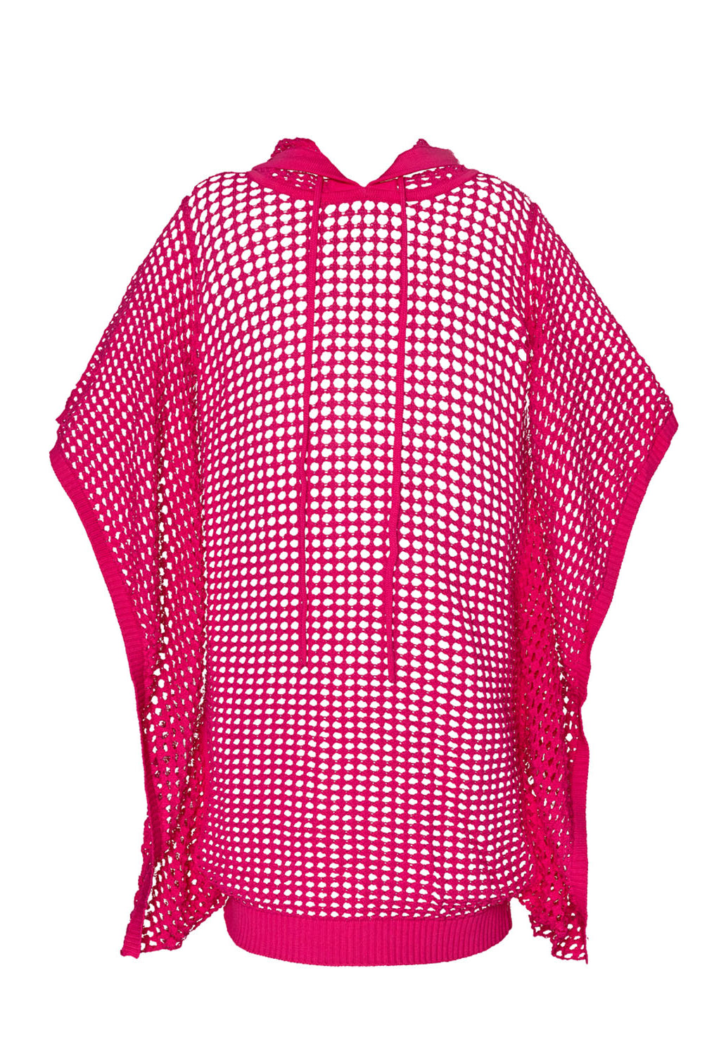 A pink knit poncho against a white wall.
