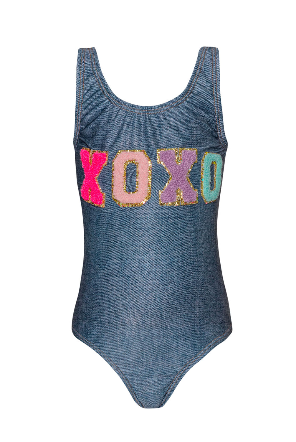A denim one piece swimsuit with XOXO across the chest against a white wall.