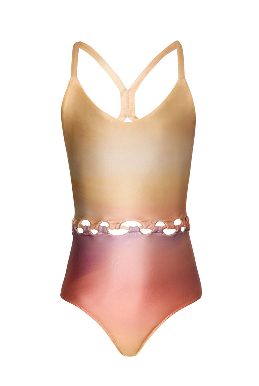 A colorful kids one piece swimsuit against a white wall.