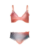 A colorful kids bikini against a white wall.