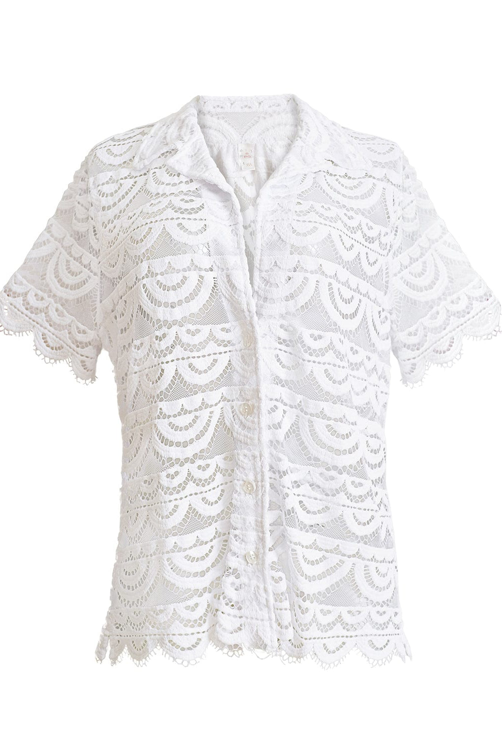 A white lace button down shirt against a white wall.