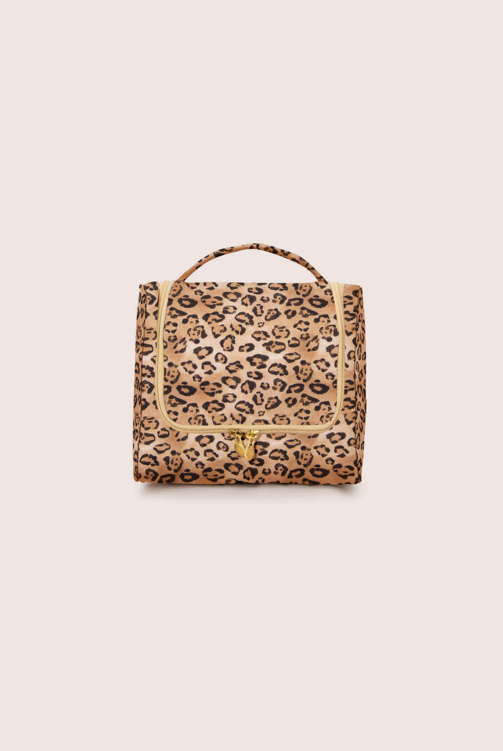 Leopard print toiletry bag on a beige background