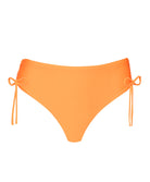 An orange modest bikini bottom against a white wall.