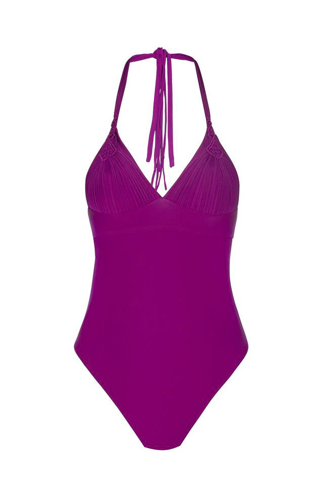 A bright magenta one-piece swimsuit with a halter neck and tie-back straps, featuring a textured, pleated cup design, shown against a plain white background.