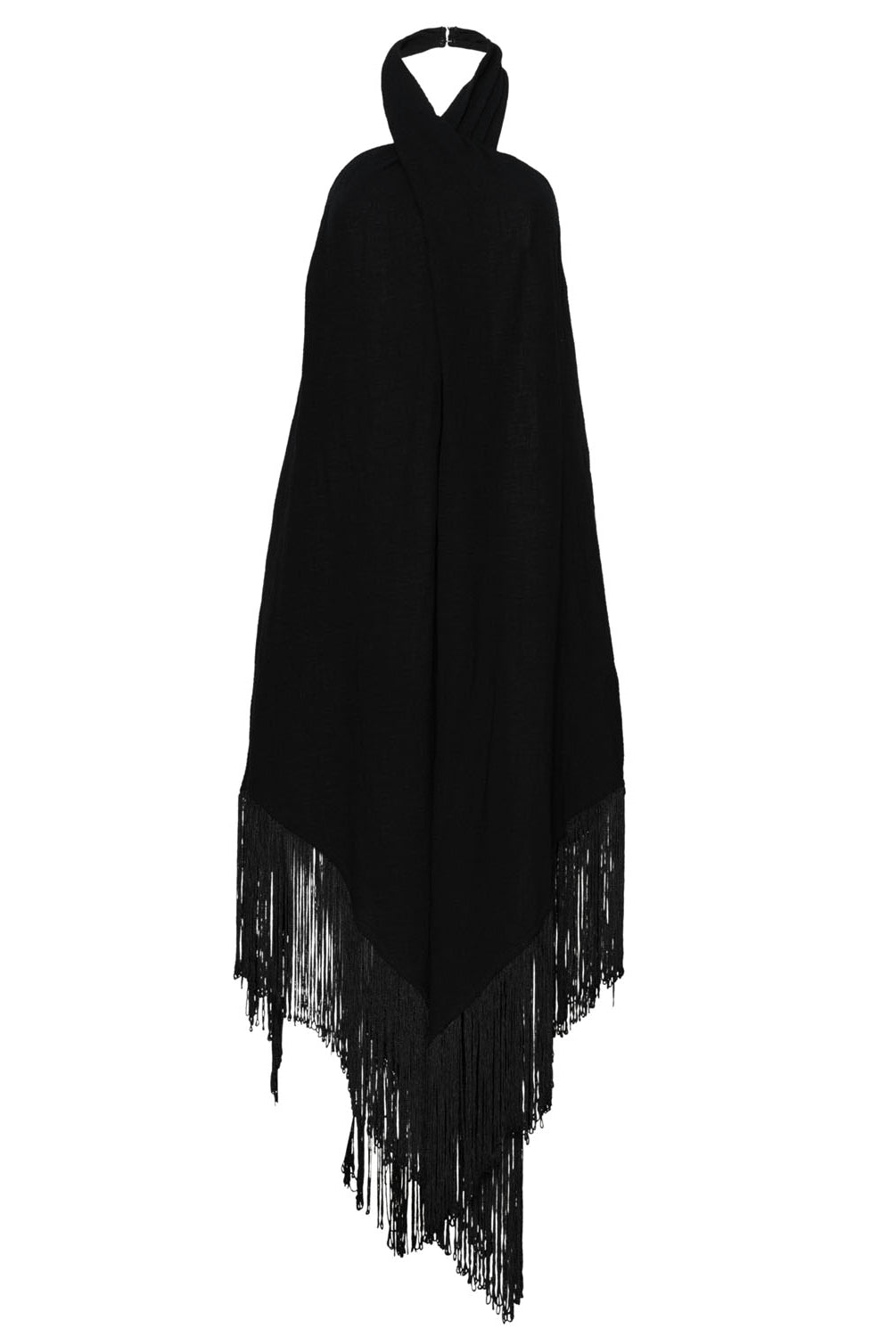 A black fringe dress that ties around the neck against a white wall.