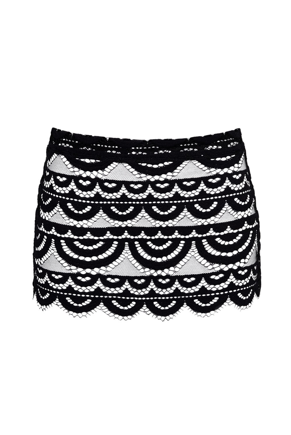 A black lace skirt with scalloped hem against a white wall.