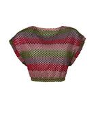 A color block crochet crop top against a white wall.