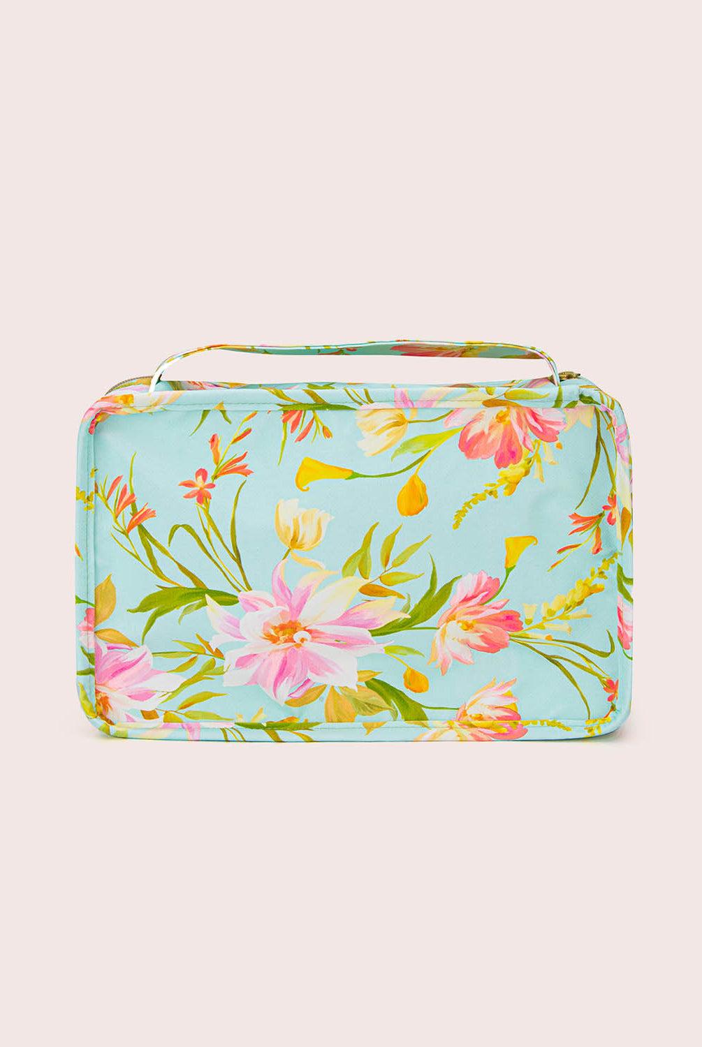 Floral-patterned rectangular packing cube on a light beige background