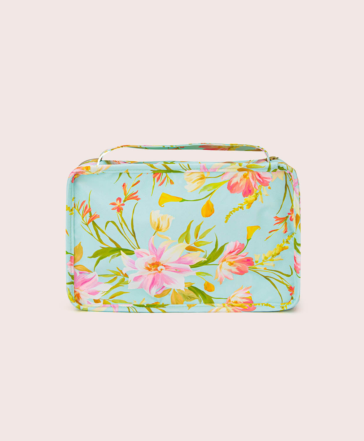 Floral-patterned rectangular packing cube on a light beige background