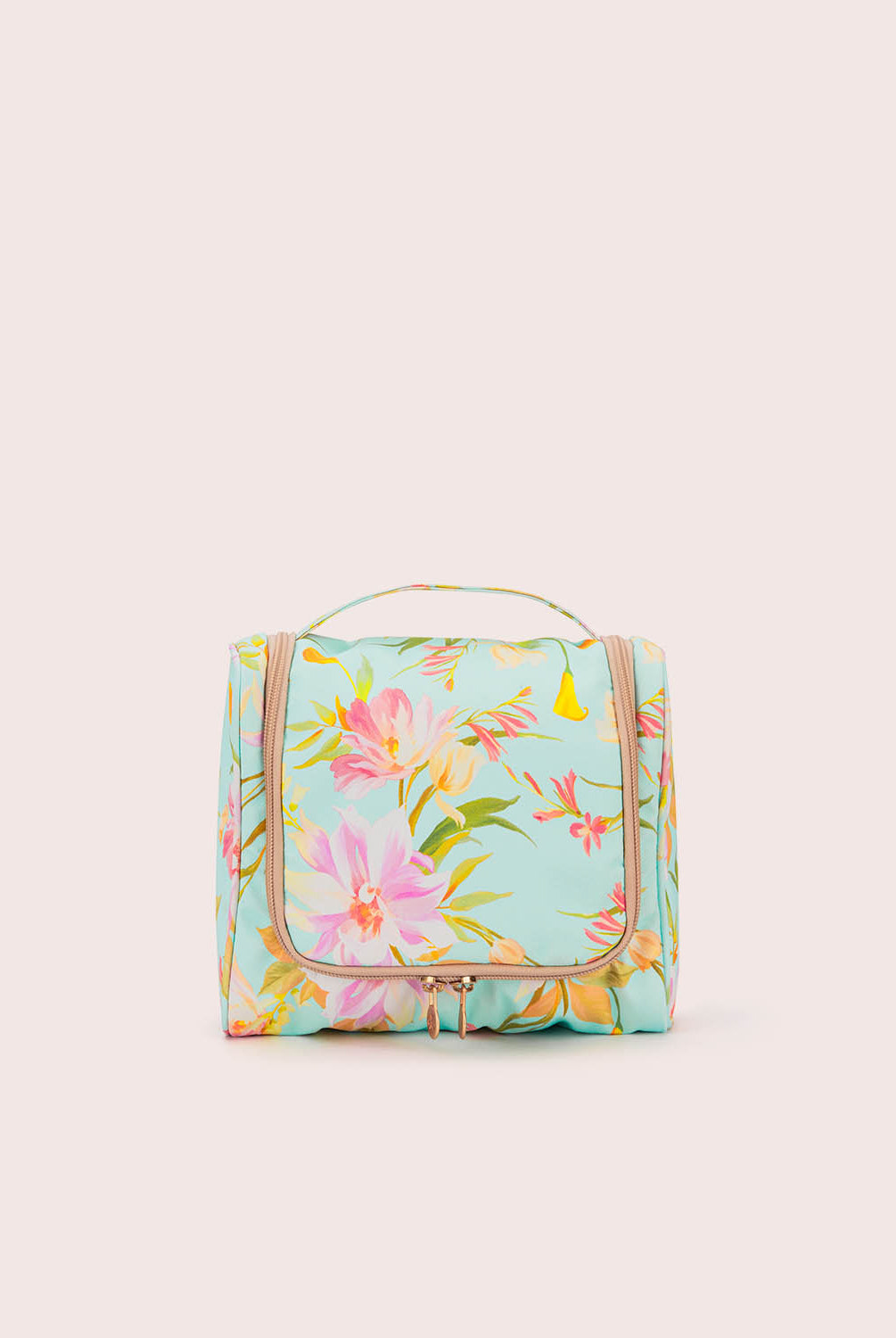 Floral-patterned toiletry bag on a light beige background