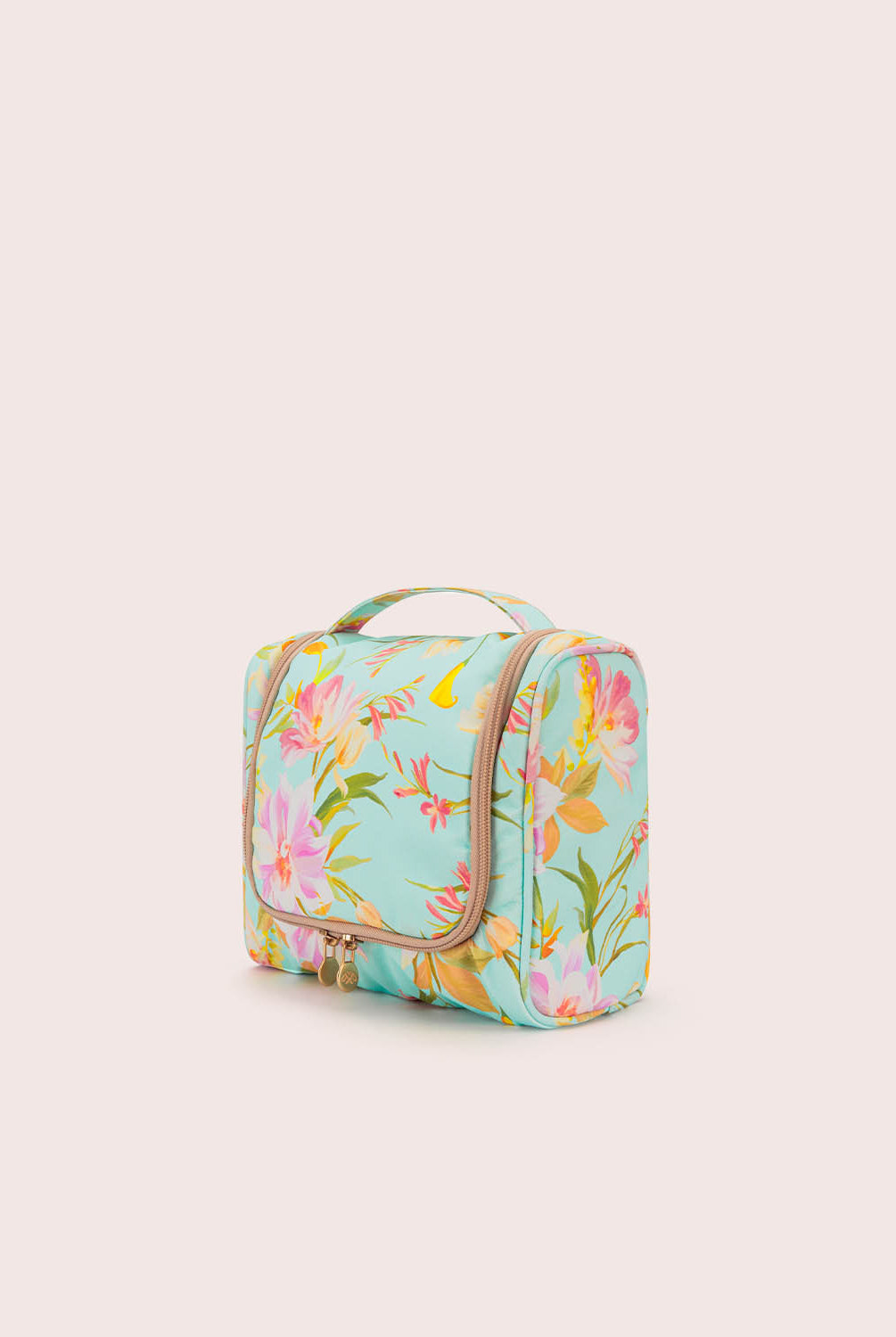 Floral-patterned toiletry bag on a light beige background