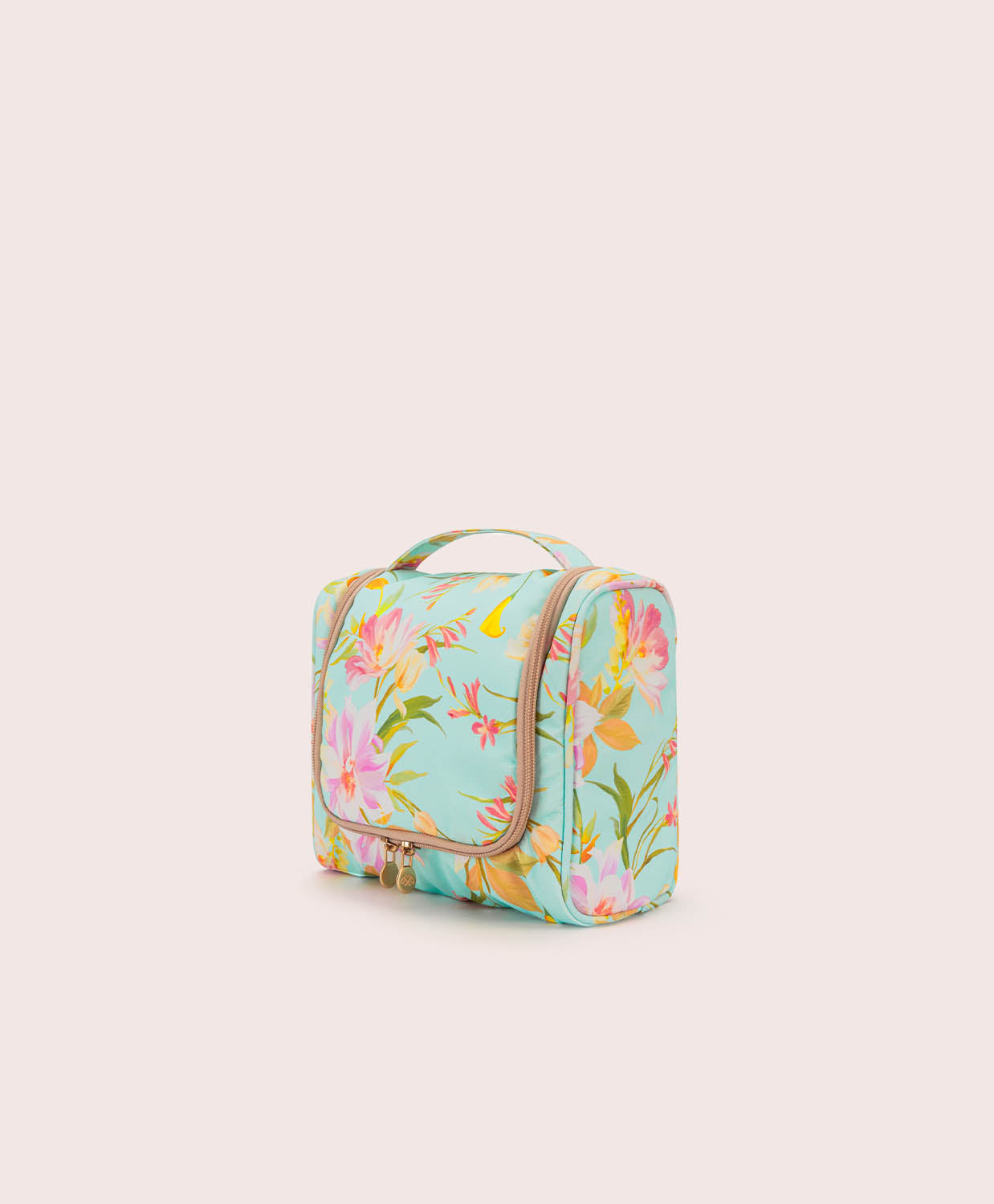 Floral-patterned toiletry bag on a light beige background