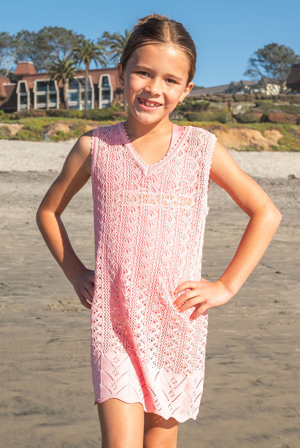 Kids Pink Sands Kaia Knit Dress – soft pink crochet cover-up with playful knit details and relaxed V-neckline.