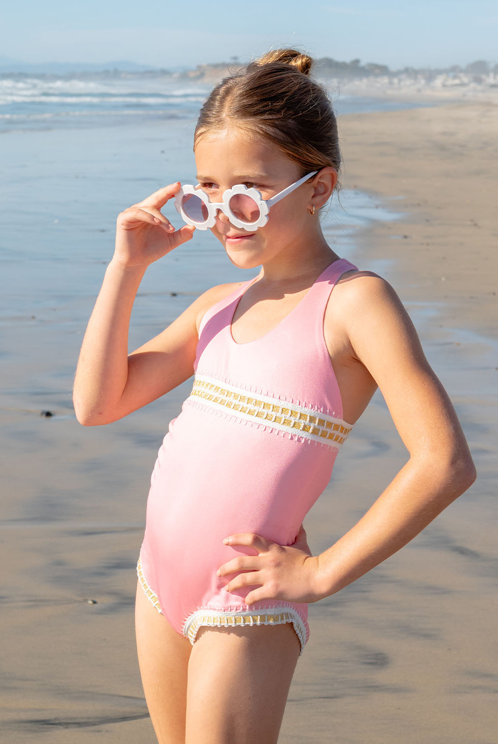 Kids Pink Sands Mabel Rainbow Embroidered One Piece – soft pink swimsuit with gold embroidery inspired by Solange Ferrarini’s colorful designs.