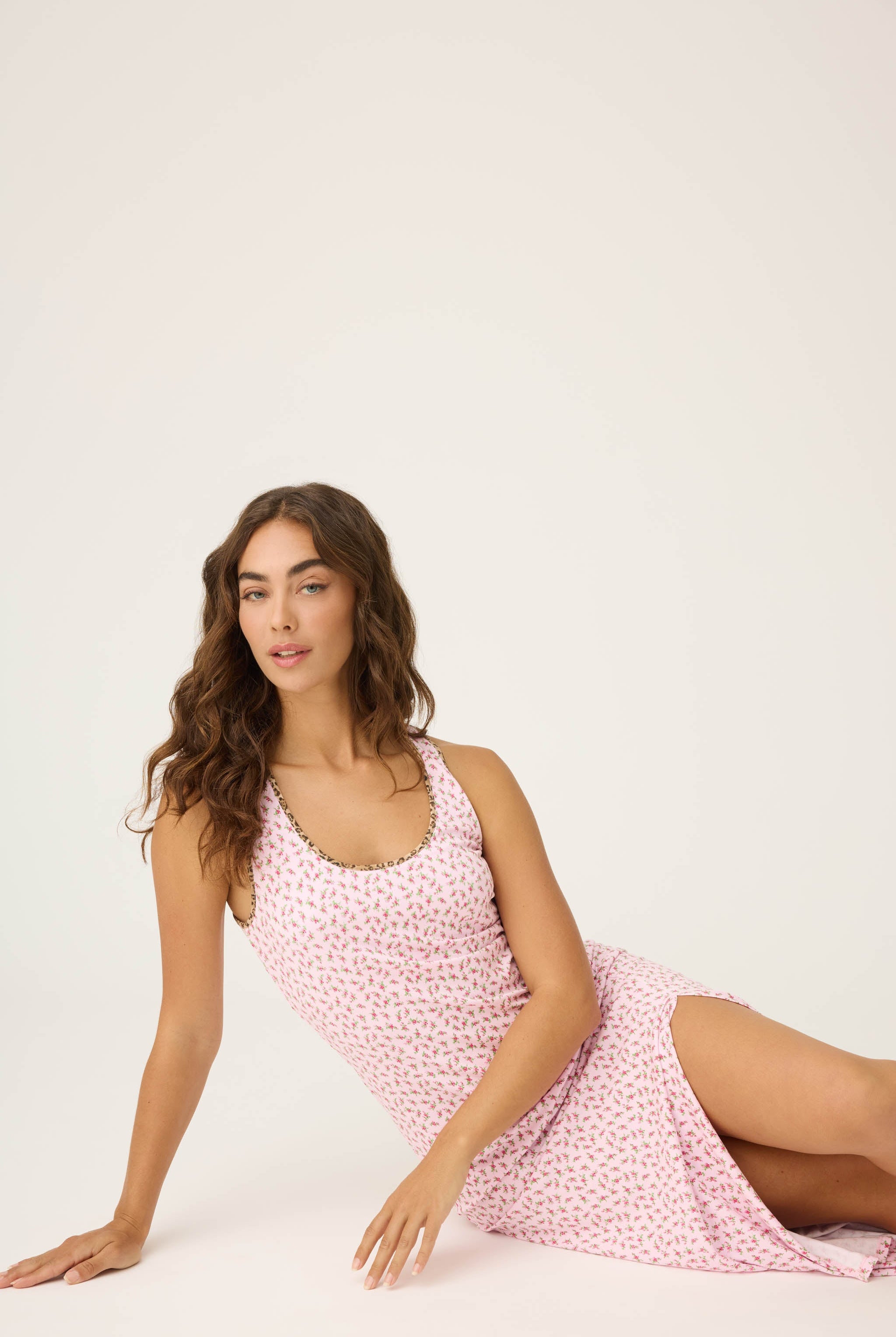 Ditsy Floral Midi Dress featuring pink dainty florals with leopard-print trim, a scoop neckline, and a side slit on a soft, midi-length tank silhouette.