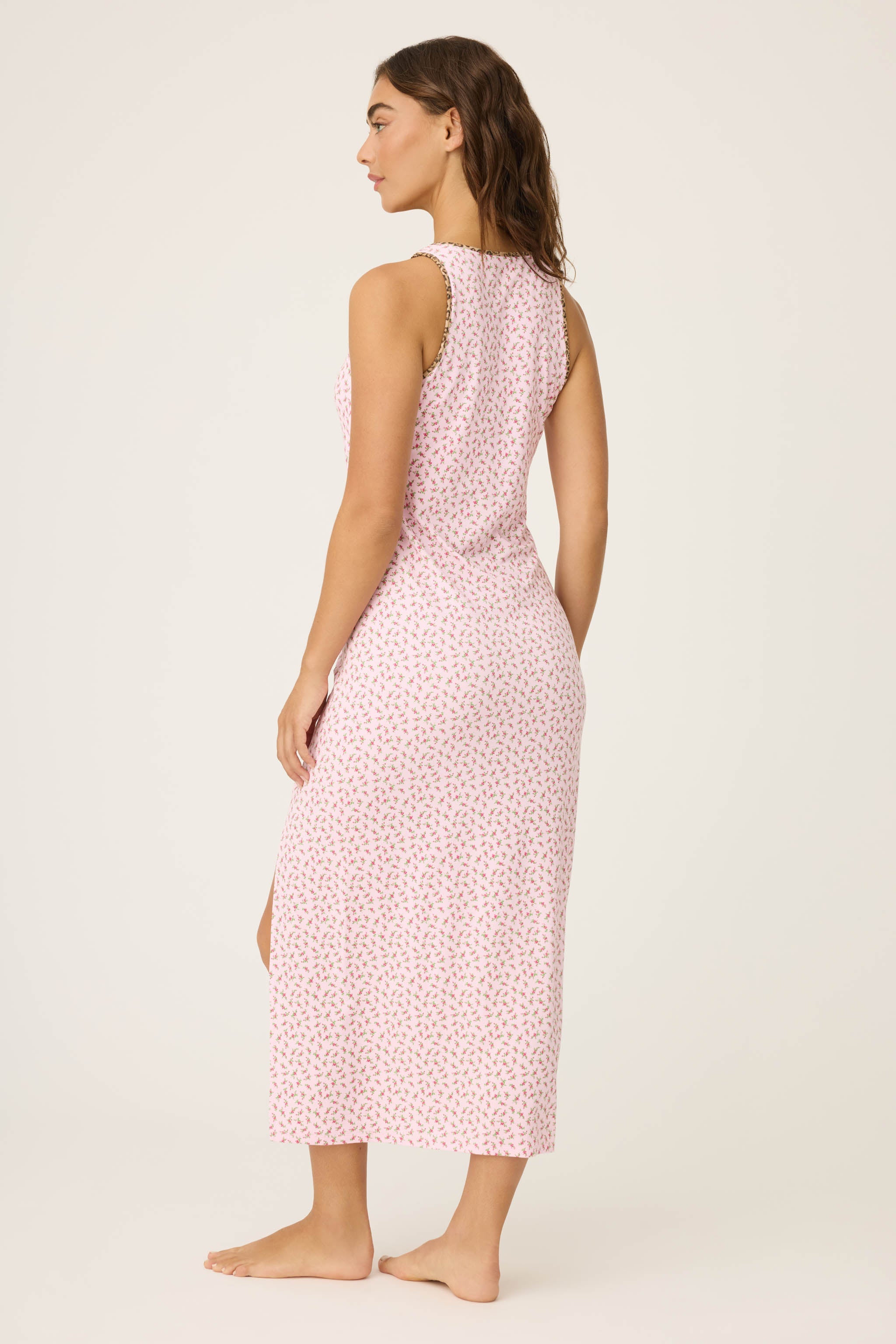 Ditsy Floral Midi Dress featuring pink dainty florals with leopard-print trim, a scoop neckline, and a side slit on a soft, midi-length tank silhouette.
