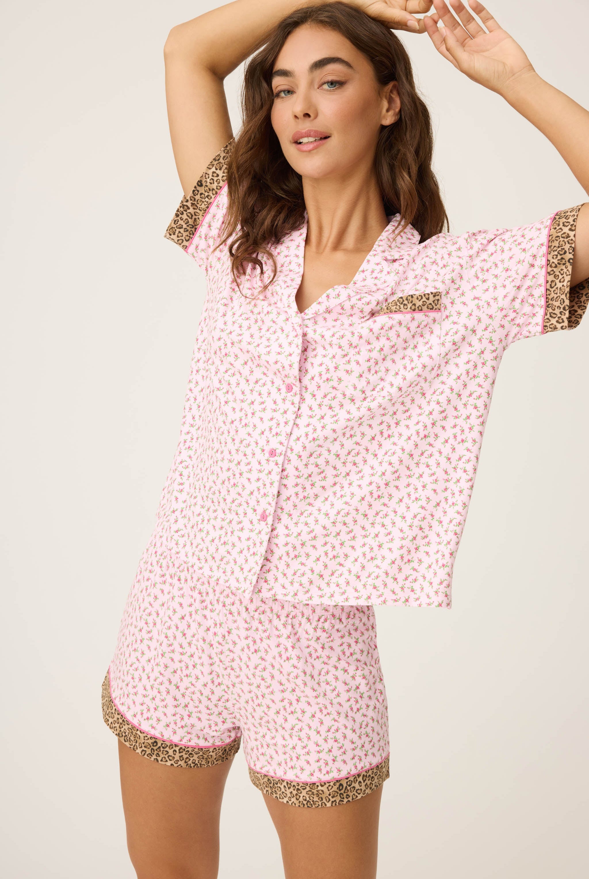 Ditsy Floral Shorts Set featuring pink ditsy florals with leopard-print trim, button-down top, and matching pull-on shorts.