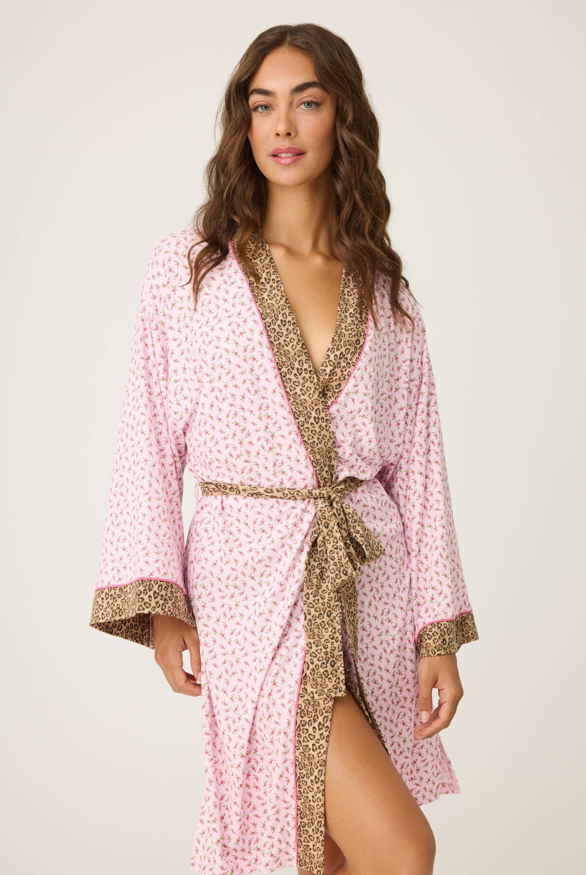 Ditsy Floral Robe featuring a pink ditsy floral print with leopard trim, wide sleeves, and a relaxed, silky-soft jersey fit.
