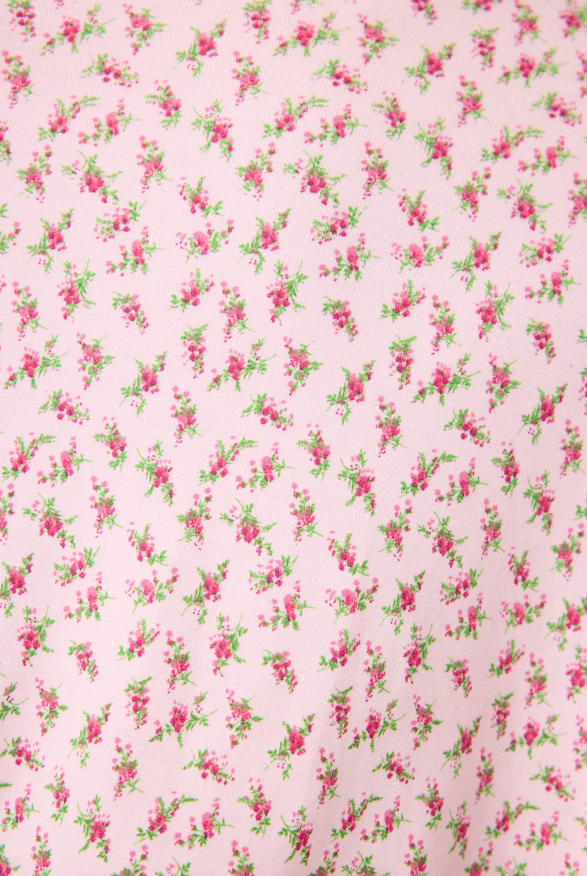 Ditsy Floral Robe featuring a pink ditsy floral print with leopard trim, wide sleeves, and a relaxed, silky-soft jersey fit.