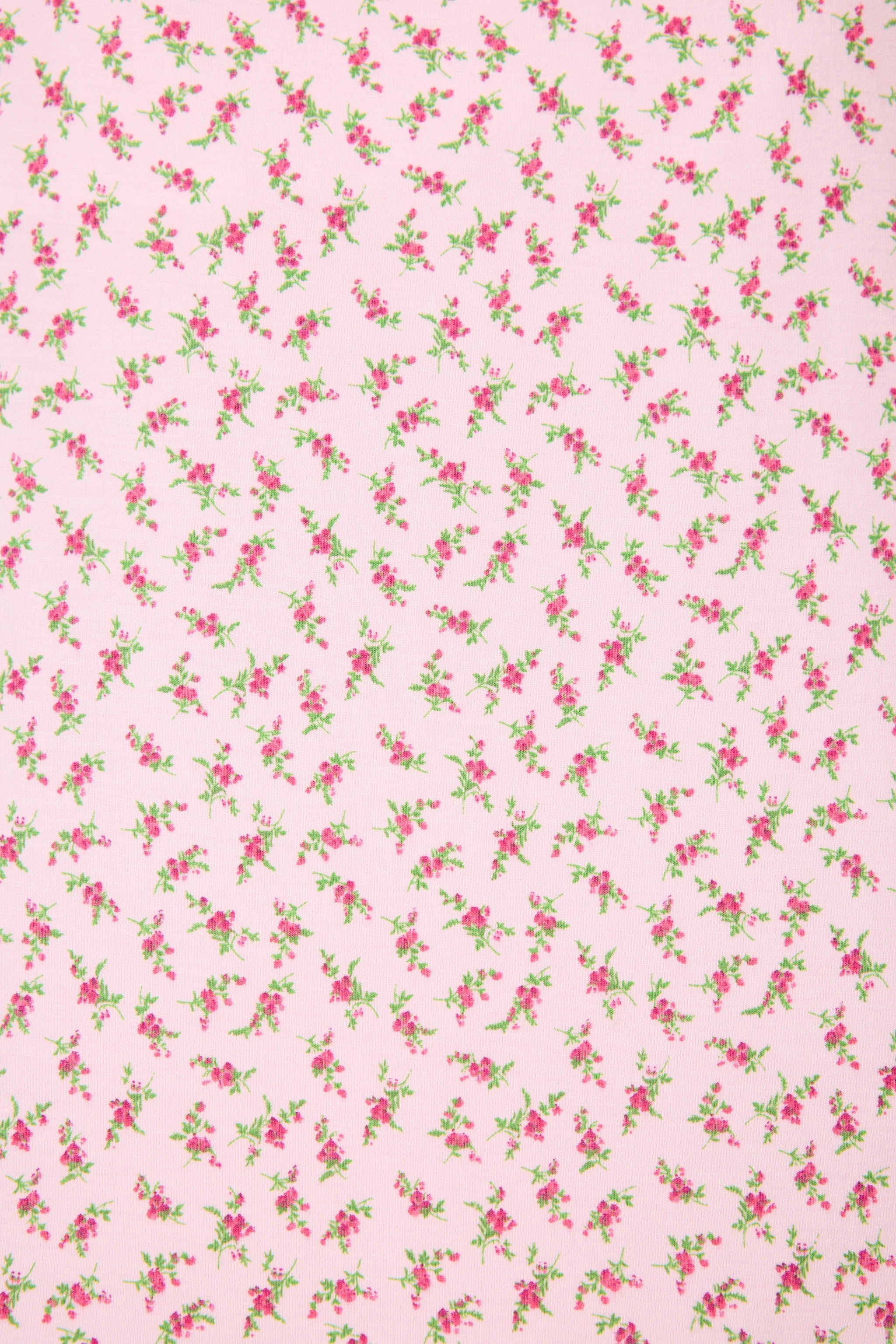 Ditsy Floral PJ Set featuring a silky cami top and wide-leg pants with pink florals and leopard-print trim.