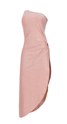 A mid length dress against a white wall.
