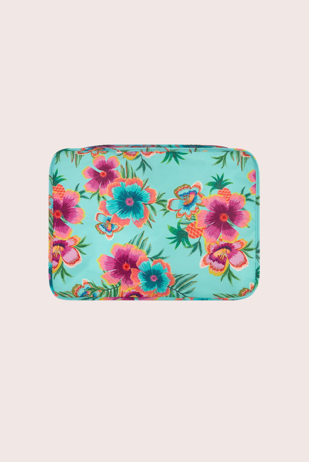 Floral patterned packing cube on a beige background