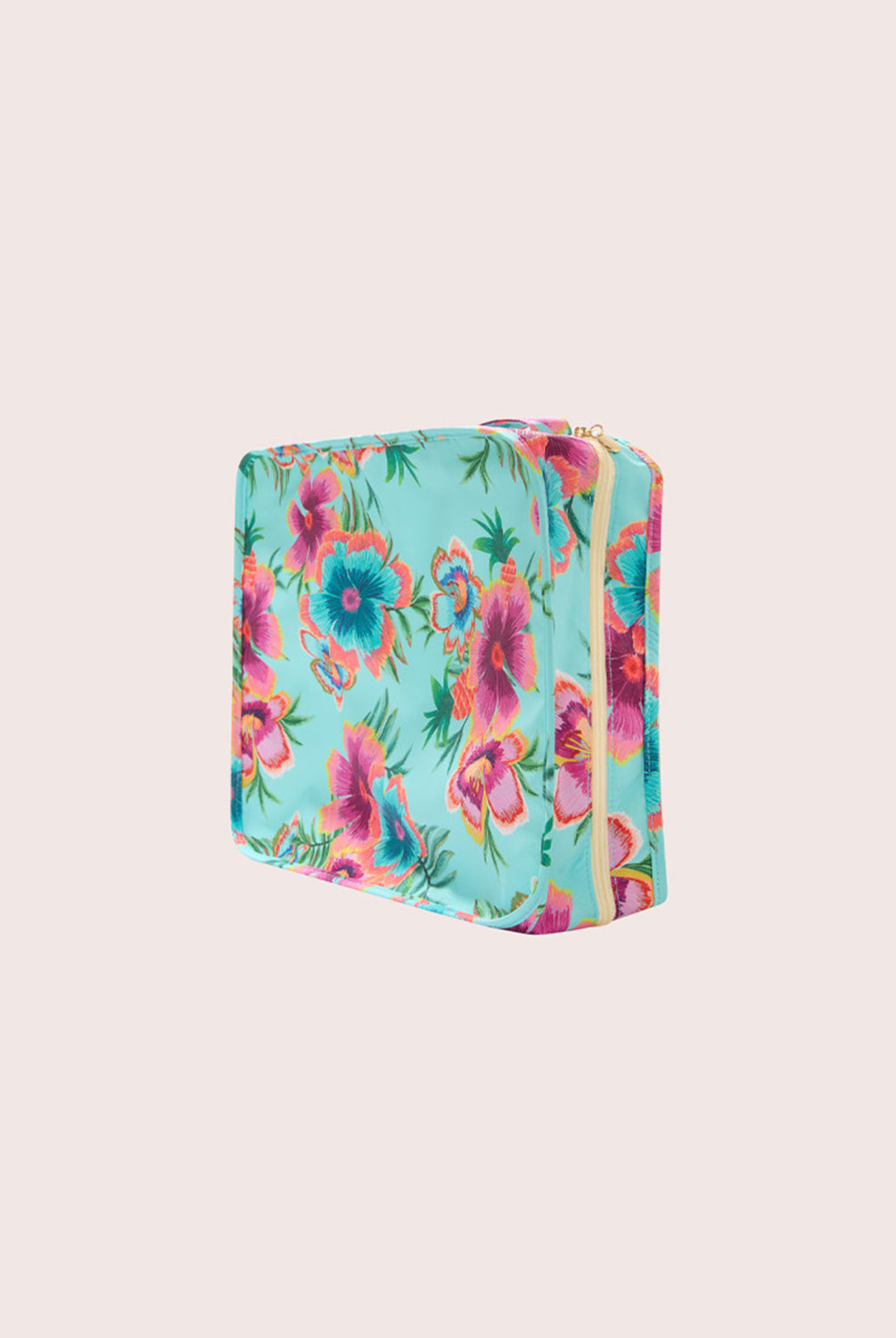 Floral-patterned packing cube on a light beige background