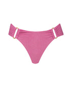 A pink bikini bottom against a white wall background.