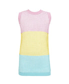 A color block knitted cover up dress against a white wall.