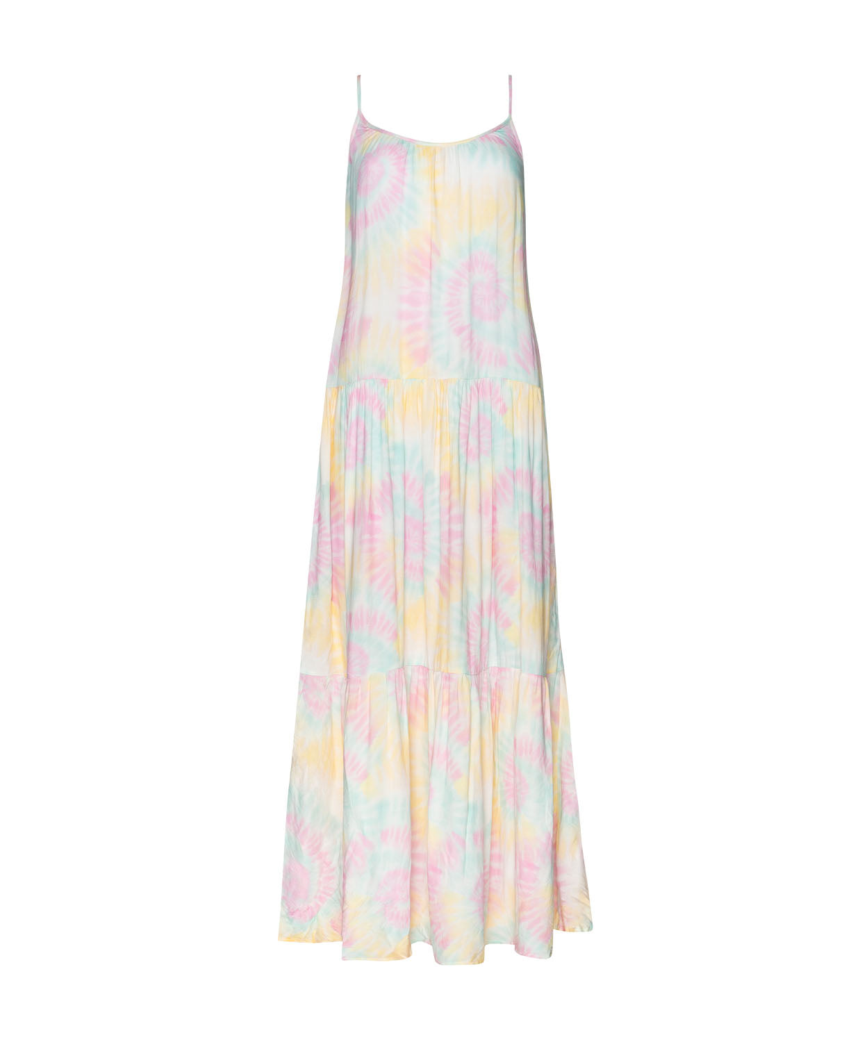 A tie-dye long dress against a white wall.