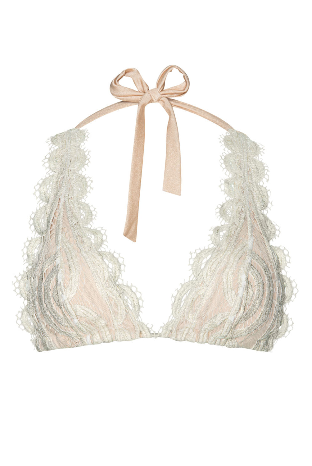 A tan and cream lace bikini top against a white wall.