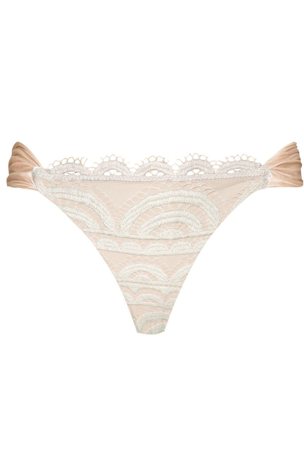 A tan and cream lace bikini against a white wall.